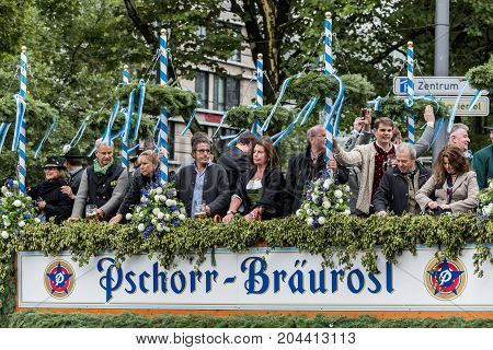 MUNICH, GERMANY - 16 OCTOBER 2017: Tent owners and breweries parade at the beginning of Oktoberfest - Hacker Pschorr parade