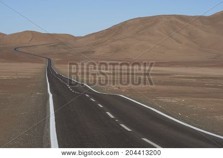 Road through the Atacama Desert to the historic coastal town of Pisagua in the Tarapaca Region of northern Chile.