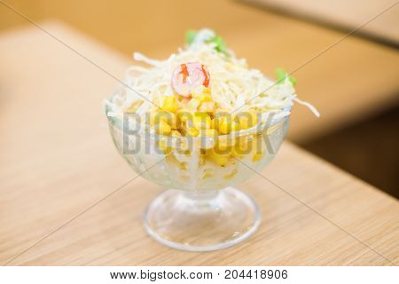 Vegetable (tomato cabbage & corn) salad serve in clear bowl for homemade food background or texture - Healthy & diet concept.