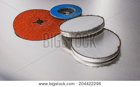 discs abrasive flap wheels on metallic background. abrasive discs and metal before processing