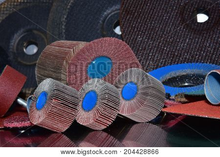 A pile of color abrasive sandpaper for metal working sandpaper for metal working