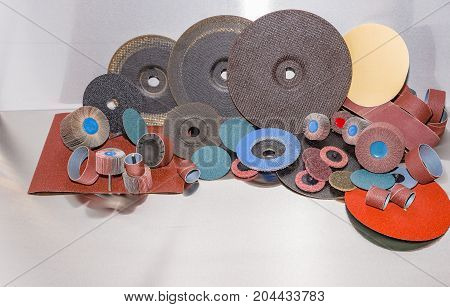 A pile of color abrasive sandpaper for metal working sandpaper for metal working