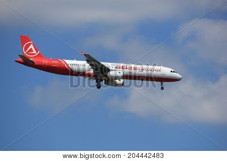 Amsterdam the Netherlands - July 9th 2017: TC-ETJ AtlasGlobal Airbus A321-200 approaching Schiphol Amsterdam Airport Kaagbaan runway