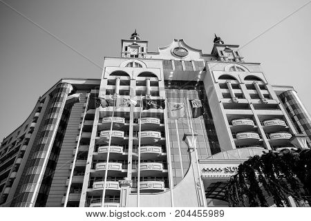POMORIE BULGARIA - AUGUST 18 2017: The multi-storey facade of the modern five-star hotel Seaside Resort. Black and white.