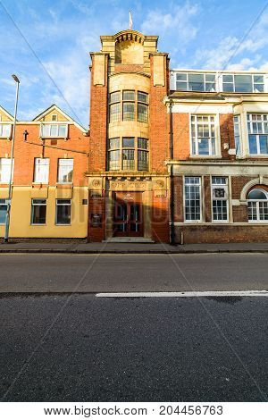 Northampton, UK - Sep 10, 2017: Low angle morning view of Churchs English Shoes Company Office facade.