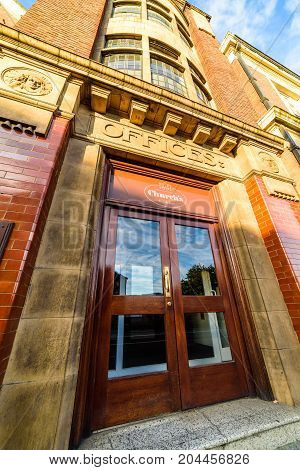 Northampton, UK - Sep 10, 2017: Low angle morning view of Churchs English Shoes Company Office facade.