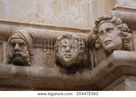 Sibenik cathedral / Famous faces on the side protal of Sibenik cathedral
