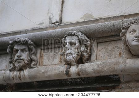 Sibenik cathedral / Famous faces on the side protal of Sibenik cathedral