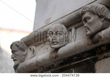 Sibenik cathedral / Famous faces on the side protal of Sibenik cathedral