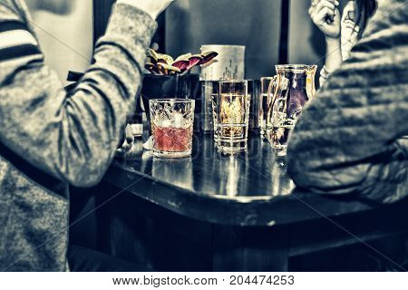 Meeting friends at the bar. Various cocktails on the bar holiday weekands