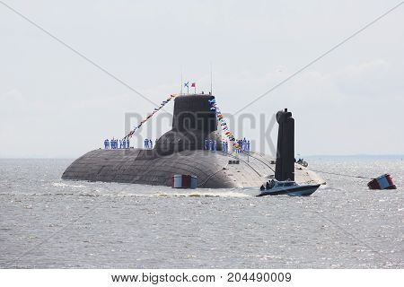 A line of modern russian military submarine cruisers in the row, northern fleet and baltic sea fleet in the open sea, submarine