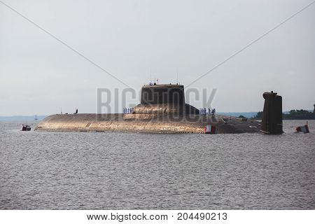 A line of modern russian military submarine cruisers in the row, northern fleet and baltic sea fleet in the open sea, submarine