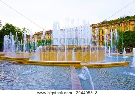 The fountain on place at Sforza Castle in summer day. Milan, Italy