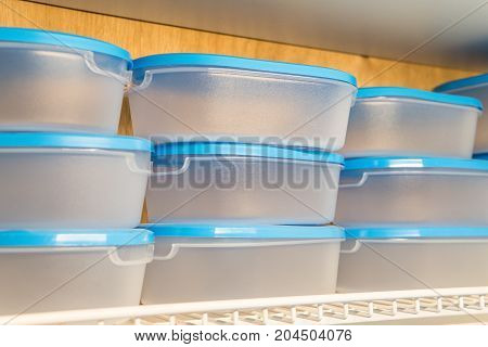 Blue plastic boxes of various sizes sold in cookware stores. Plastic can be used to store different types of food as well. Suitable for women who love to organize the kitchen.
