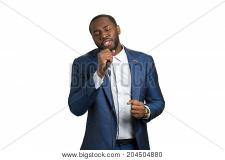 Afro singer with closed eyes. Bearded singer on white background. Great passion and talent.
