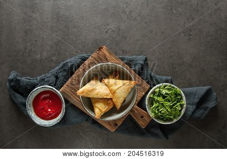 Asian Food. Vegetarian Samsa With Tomato Sauce And Herbs. Dark B