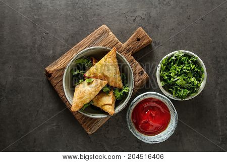 Asian Food. Vegetarian Samsa With Tomato Sauce And Herbs. Dark B