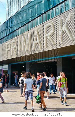 BERLIN, GERMANY - AUGUST 08, 2017: Tourists and residents in front of a branch of the fashion discounter Primark at Alexanderplatz in Berlin