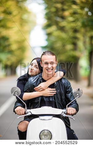 Couple In Love Riding A Motorbike. Handsome Guy And Young Sexy Woman Travel Hug.