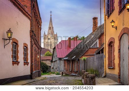 Empty cobblestone streets and church tower in the small town of Cesis, Latvia