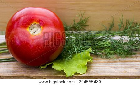 Fresh Vegetables on old wooden table - Tomatoes onions dill lettuce