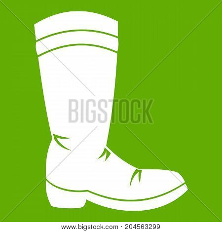 Cowboy boot icon white isolated on green background. Vector illustration