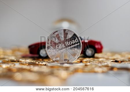 Bitcoin Coin Near Red Car