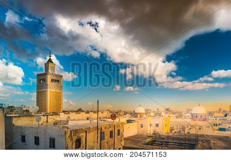 View of the Al-Zaytuna Mosque and the skyline of Tunis at dawn. The mosque is a Landmark of Tunis. Tunisia, North africa.