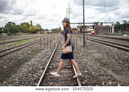 Asian Lady Waling On Railway
