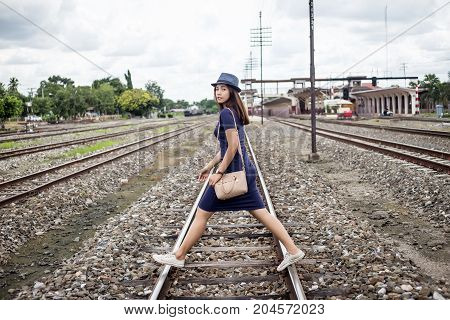 Asian Lady Waling On Railway