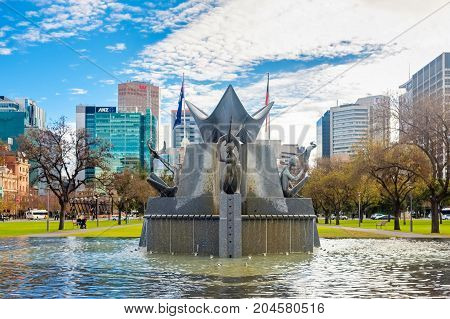 Adelaide Australia - June 28 2017: Victoria Square fountain viewed from South to North with buildings and traffic at morning time
