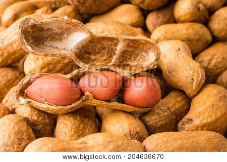 Close up of Peanuts on plie of peanuts background.