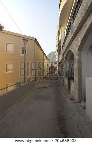Narrow Empty Street Of Medieval Town On A Sunny Dag
