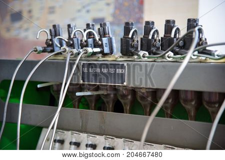 close-up high pressure diesel fuel pump test bench on work