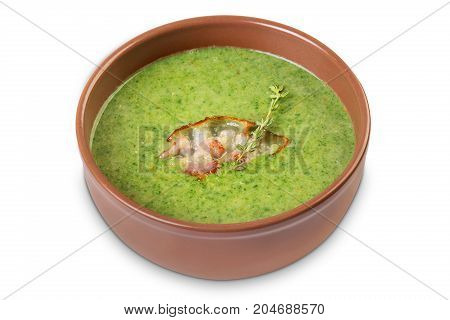 Cream soup with sarin and bacon isolated on white background