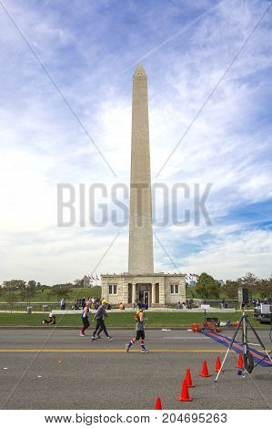 Washington D.C USA, october 30 2016: Runners compete in the Marine Corps Marathon under the George Washington Monument in Washington D.C
