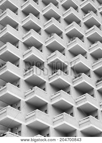 high rise building with residential flats or apartments in a white concrete development with balconies