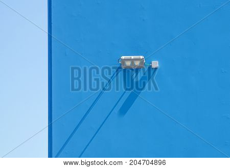 LED floodlight on wall of industrial covered .