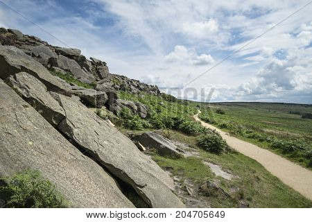 Beautiful Vibrant Landscape Image Of Burbage Edge And Rocks In Summer In Peak District England
