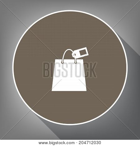 Shopping bag sign with tag. Vector. White icon on brown circle with white contour and long shadow at gray background. Like top view on postament.