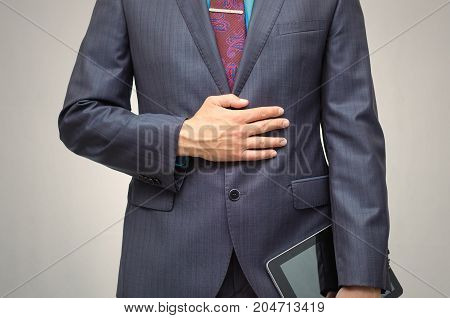 Product presentation. Promotion. Market research. Business man holding in hand tablet PC with blank screen close up.