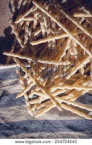 Homemade pasta lying on a wood cutting board