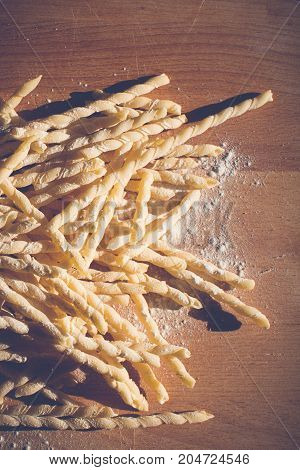 Homemade pasta lying on a wood cutting board