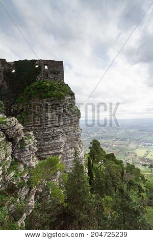 Castle dedicated to goddess Venus on Erice mountain. In the background the plan of Trapani