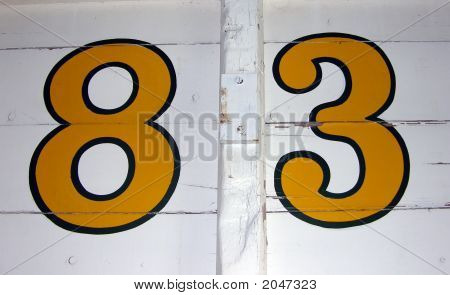 Hand Painted Number 83 On Wooden Background