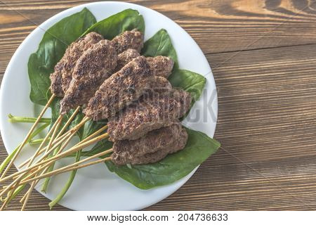 Beef Cabobs On The Fresh Spinach Leaves