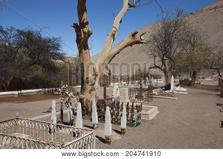 Tiliviche, Tarapaca Region, Chile - August 21, 2017: Historic British Cemetery from the era of nitrate mining in the Atacama Desert, in the grounds of Hacienda Tiliviche in northern Chile.