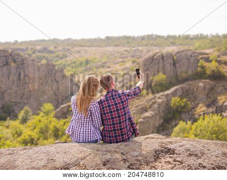 A young couple came to the mountains for a vacation. Healthy lifestyle.