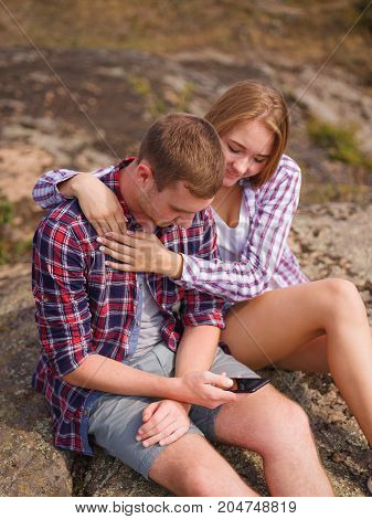 A young couple came to the mountains for a vacation. Healthy lifestyle.