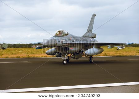 Schleswig - Jagel Germany - June 19 2014: Netherlands - Air Force General Dynamics F-16A Fighting Falcon J-643 is taxiing on strip of airbase Schleswig - Jagel during NATO Tiger Meet 2014.
